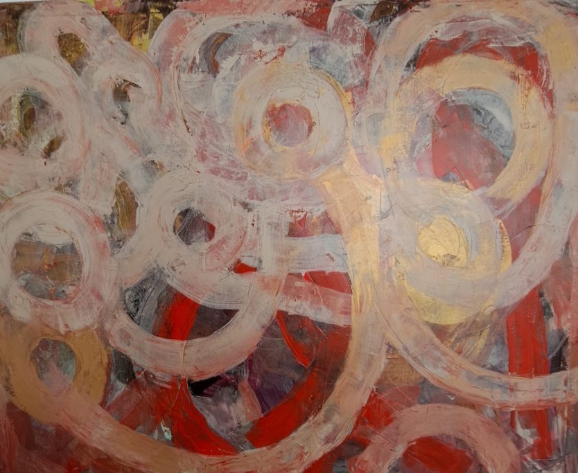 Cuadro con composición abstracta con círculos y trazos en tonos rojos, beige y grises.